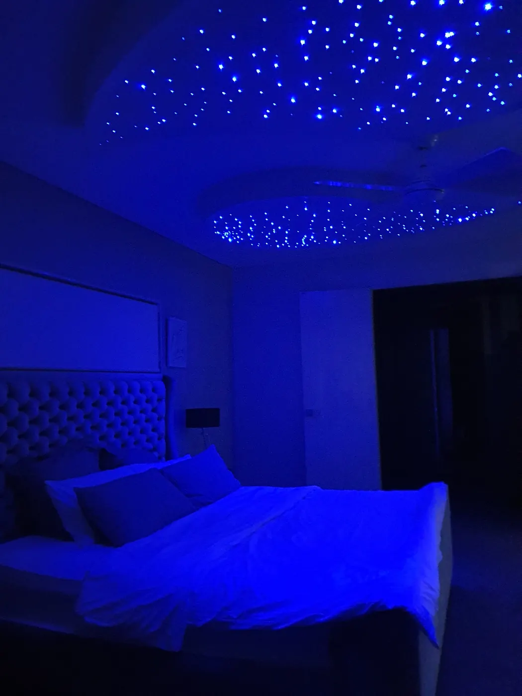 Bedroom with blue star ceiling