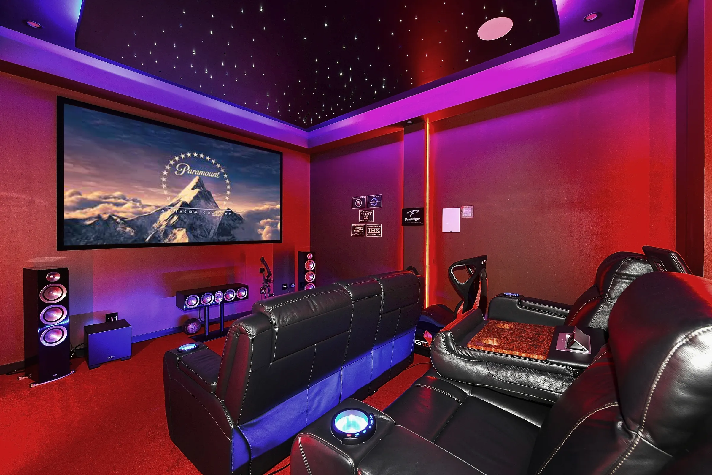 Finished home theatre in Kellyville: fibre-optic star ceiling, LED cove lighting, projection screen and leather recliners