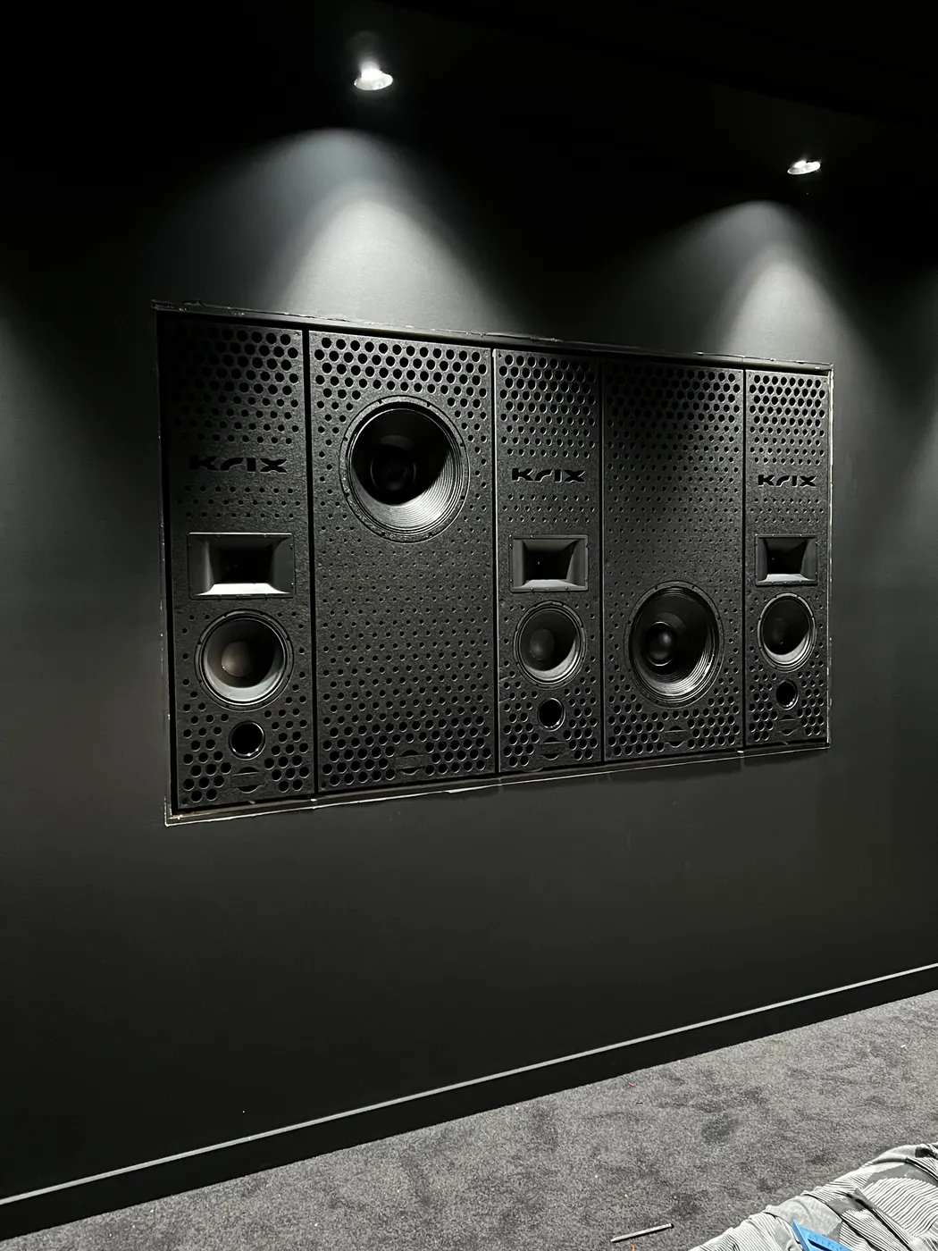 Krix in-wall speaker array behind the screen wall